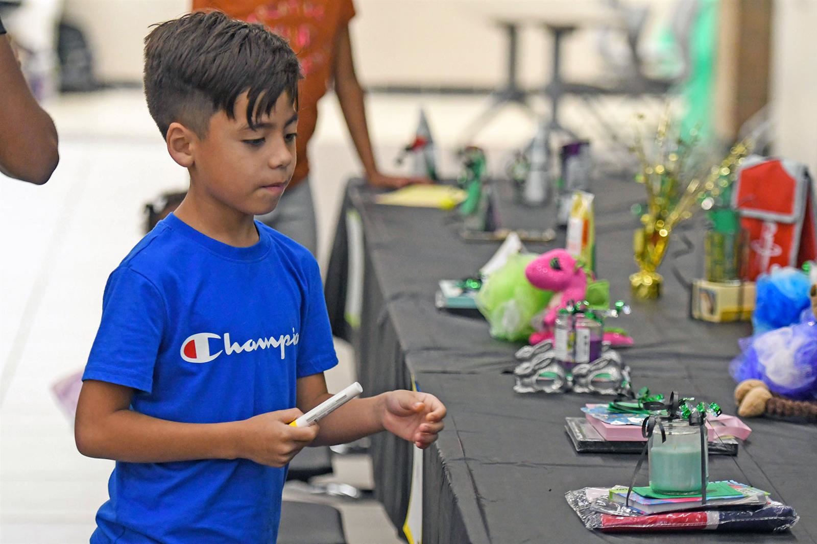 A “Bingo with the Counselors” participant looks over the prizes during the event at Campbell Middle School on Oct. 13. 